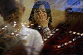 People pray for the victims of Malaysia Airlines Flight 17 at a church outside Kuala Lumpur, Malaysia on July 18, 2014. (Joshua Paul—AP)